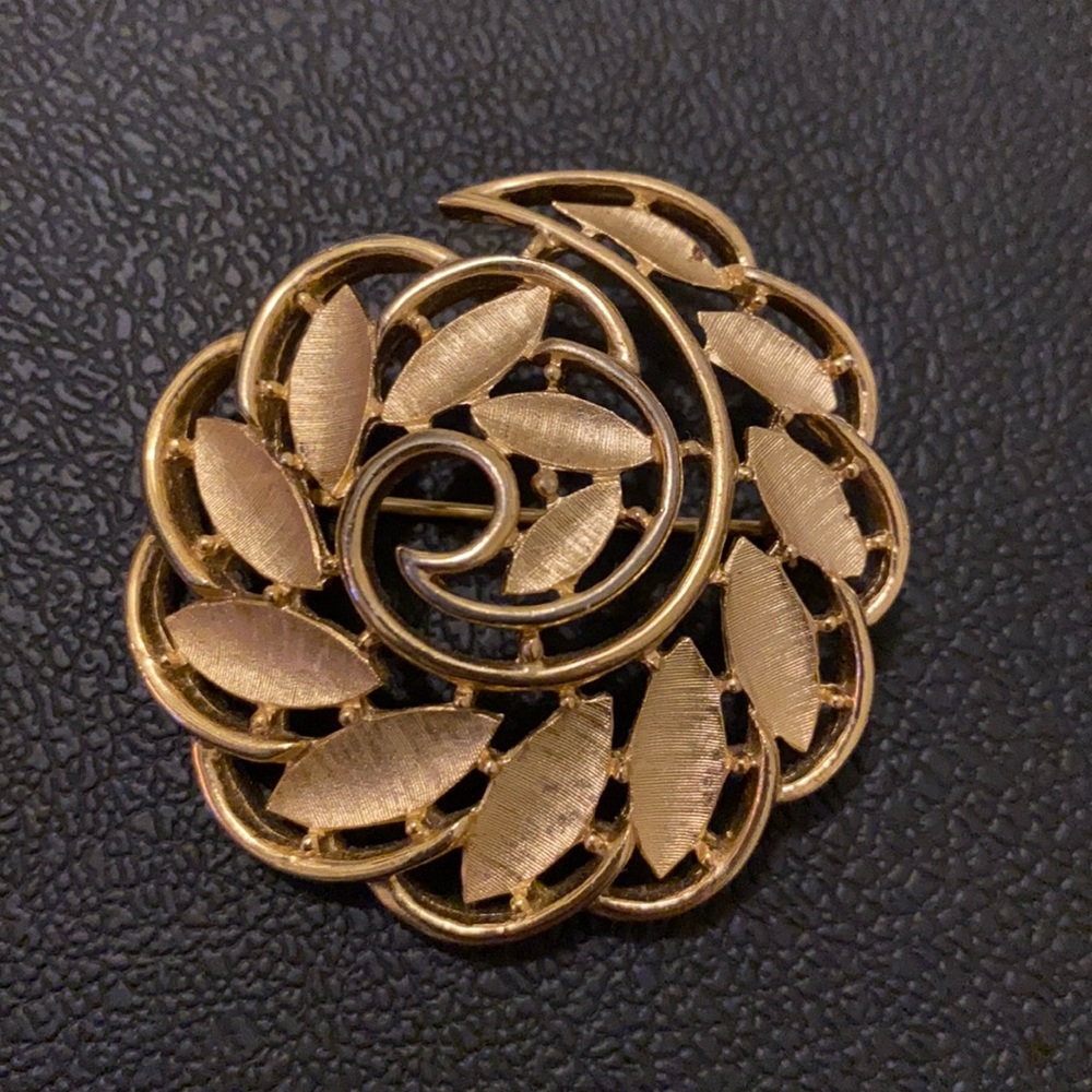 Gold spiral brooch